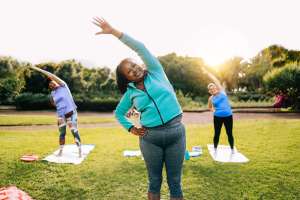 Senior sport people exercising during yoga workout class outdoor at park city – Fitness joyful Elderly lifestyle